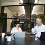 man and woman having a meeting in the office